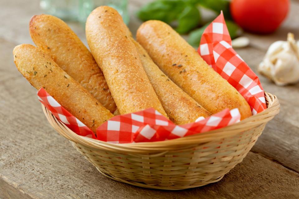 <p>If you've ever heard a rumor that Olive Garden servers re-serve breadsticks that went to a table but weren't eaten, don't stress. A server told <a href="https://www.reddit.com/r/AMA/comments/8v3c5f/i_work_at_an_olive_garden_ama/e1k7qo2/" rel="nofollow noopener" target="_blank" data-ylk="slk:Reddit;elm:context_link;itc:0;sec:content-canvas" class="link ">Reddit</a>, "We always throw out uneaten bread. (Or servers eat it)." Another server <a href="https://www.reddit.com/r/IAmA/comments/uwcpo/iama_former_olive_garden_employee_ask_me_anything/c4z8qjt/" rel="nofollow noopener" target="_blank" data-ylk="slk:added;elm:context_link;itc:0;sec:content-canvas" class="link ">added</a>, "There are like BILLIONS of breadsticks in the back. Towers of them. You would be amazed on how many we threw out that weren't perfect. So re-using? Nope." Your breadsticks are safe! </p>