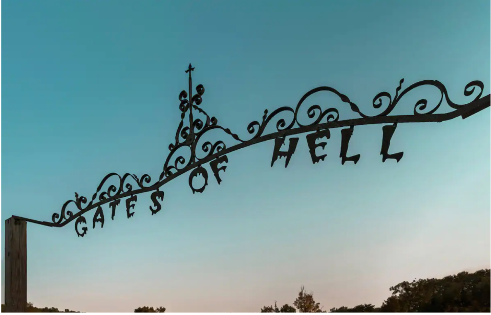 The gates of hell, which welcome you to the property. (Photo: Airbnb)