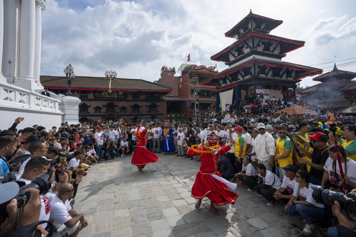 Masked dancers perform during Indra Jatra, a festival that marks the end of the rainy season in Kathmandu, Nepal, Tuesday, Sept. 17, 2024. (AP Photo/Niranjan Shrestha)