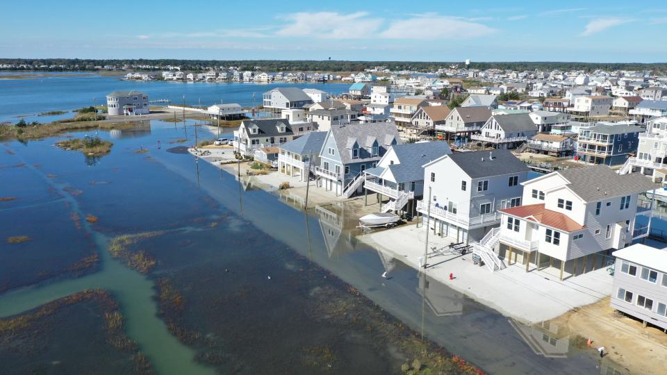 King tide flooding occurs in Tuckerton Beach in Southeastern New Jersey in October 2019. NOAA records show such high tide flooding is occurring more often. [Photos by Life on the Edge Drones, provided by Jacques Cousteau National Estuarine Research Reserve]