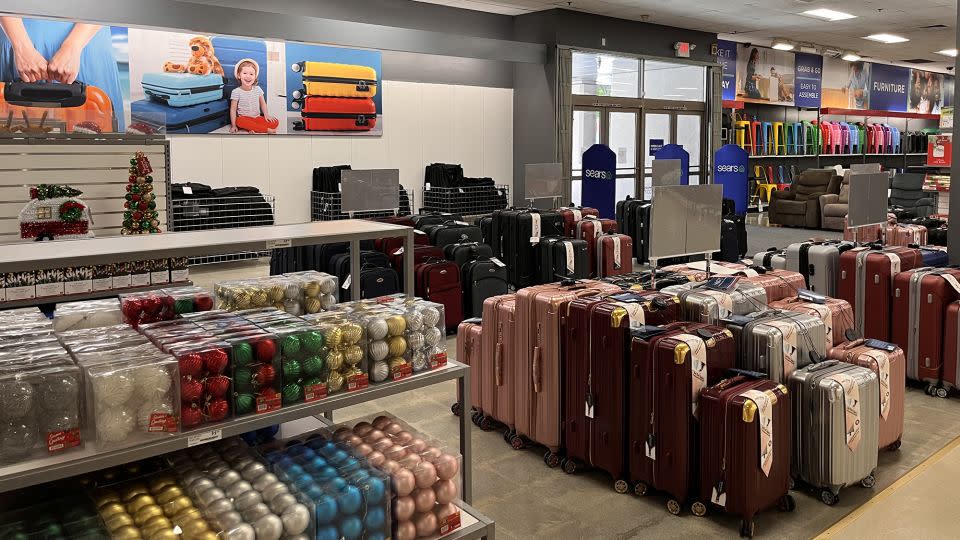 A seasonaly holiday decorations display sat next to the luggage section at the reopened Sears store in Burbank, CA, on December 1. - Samantha Delouya/CNN