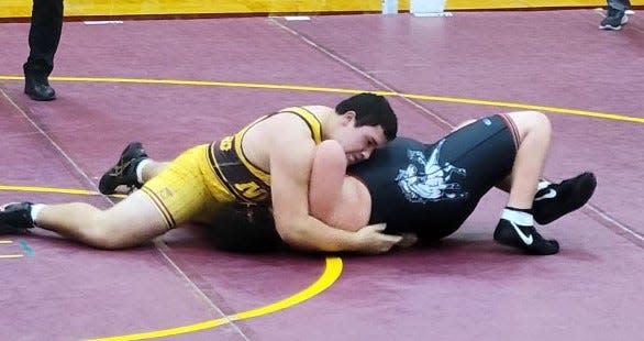 Bloomington North's Max Wynalda takes control of his 285-pound match against Edgewood's Kegan Lane. Wynalda won by pin in 1:24.