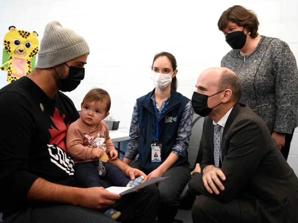 Minister of Health Jean-Yves Duclos meets with families with children receiving their COVID-19 vaccinations at a clinic in Ottawa on Wednesday, Nov. 23, 2022. (Justin Tang/Canadian Press - image credit)