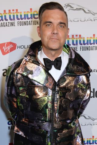 <p>David M. Benett/Dave Benett/Getty</p> Robbie Williams in 2018
