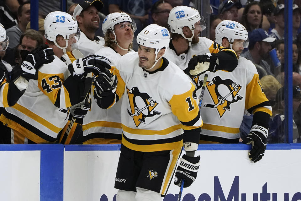 Pittsburgh Penguins center Brian Boyle (11) celebrates with the bench after his goal against the Tampa Bay Lightning during the second period of an NHL hockey game Tuesday, Oct. 12, 2021, in Tampa, Fla. (AP Photo/Chris O'Meara)