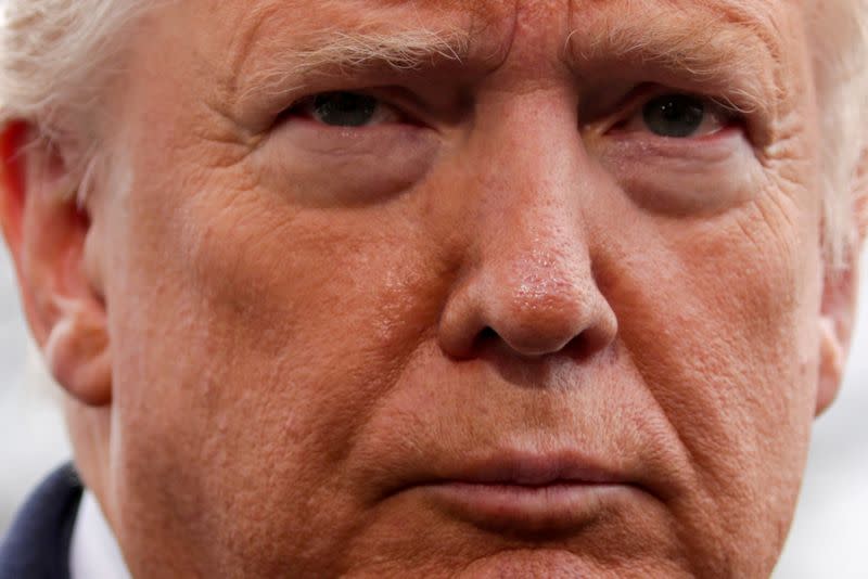 FILE PHOTO: U.S. President Trump speaks to reporters as he departs for travel to North Carolina from in Washington