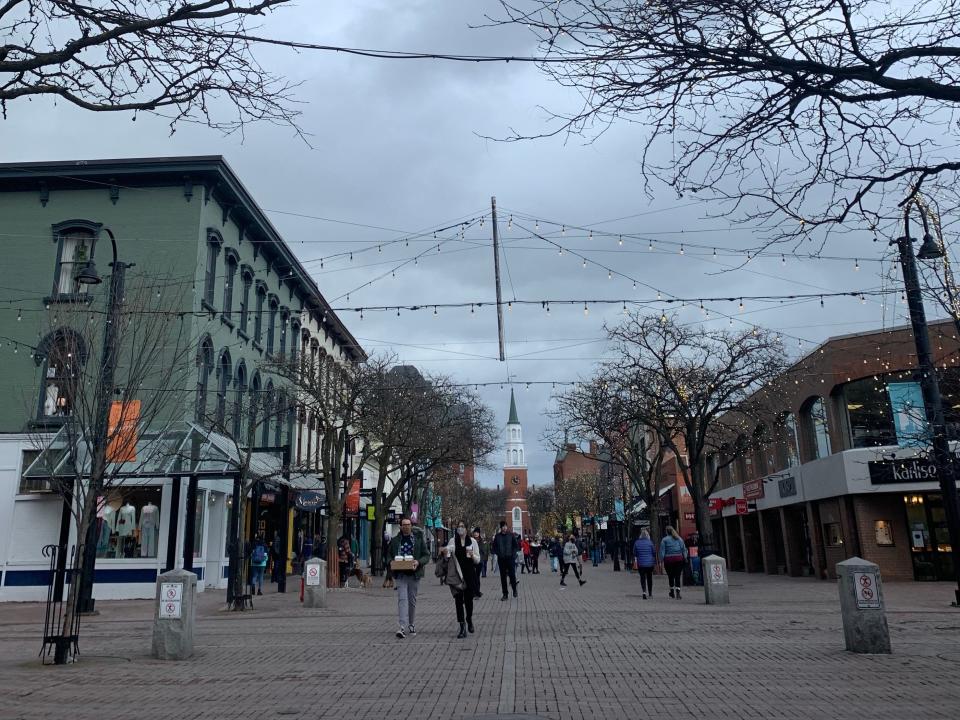 burlington vermont town, street view of shops and tower in the background