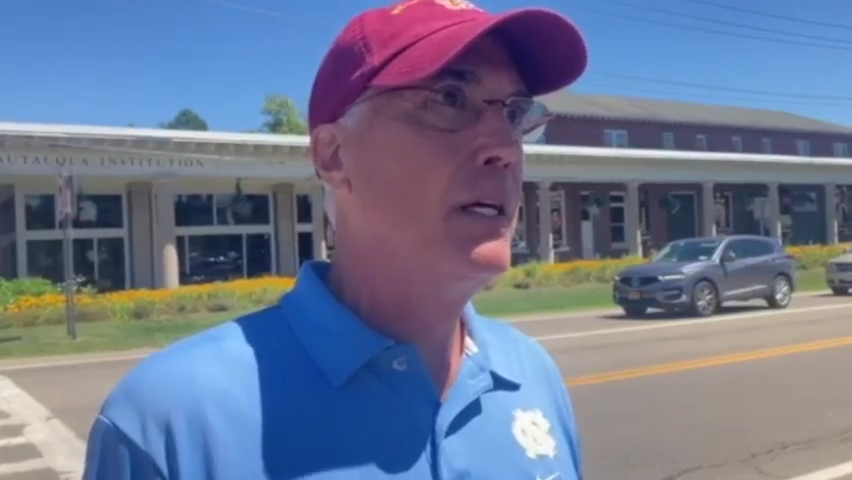 This is a video frame grab of David Johnson, a Pittsburgh resident who was in the audience for the Salman Rushdie event on Aug. 12, 2022, said he saw a man  charge the stage and tackle Rushdie.