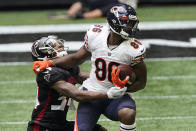 Chicago Bears tight end Demetrius Harris (86) runs against Atlanta Falcons defensive back Darqueze Dennard (34) during the second half of an NFL football game, Sunday, Sept. 27, 2020, in Atlanta. The Chicago Bears won 30-26. (AP Photo/John Bazemore)