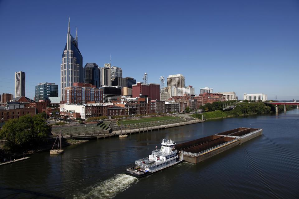 FILE -- This Sept. 27, 2011 file photo shows the Cumberland River and downtown Nashville, Tenn. The banks of the river and the bridges over it offer viewpoints for the skyline that inspired Bob Dylan to write a country album. (AP Photo/Mark Humphrey, File)