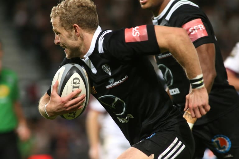 Brive's Guillaume Namy runs with the ball during their French Top 14 rugby union match against Bordeaux, at the Amede Domenech stadium in Brive, on November 7, 2015