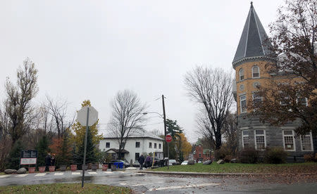 The Haskell Free Library and Opera House, straddles the U.S.-Canada border as seen by large flower pots marking the border line between Stanstead, Quebec, Canada and Derby Line, Vermont, U.S., November 3, 2018. Picture taken November 3, 2018. REUTERS/Yeganeh Torbati