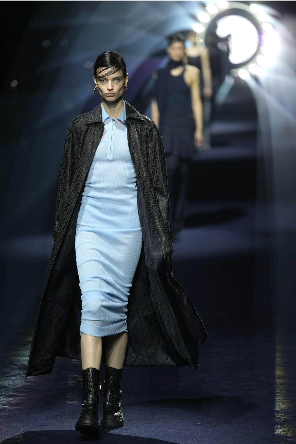 A model wears a creation as part of the Fendi women's Fall-Winter 2023-24 collection presented in Milan, Italy, Wednesday, Feb. 22, 2023. (AP Photo/Antonio Calanni)
