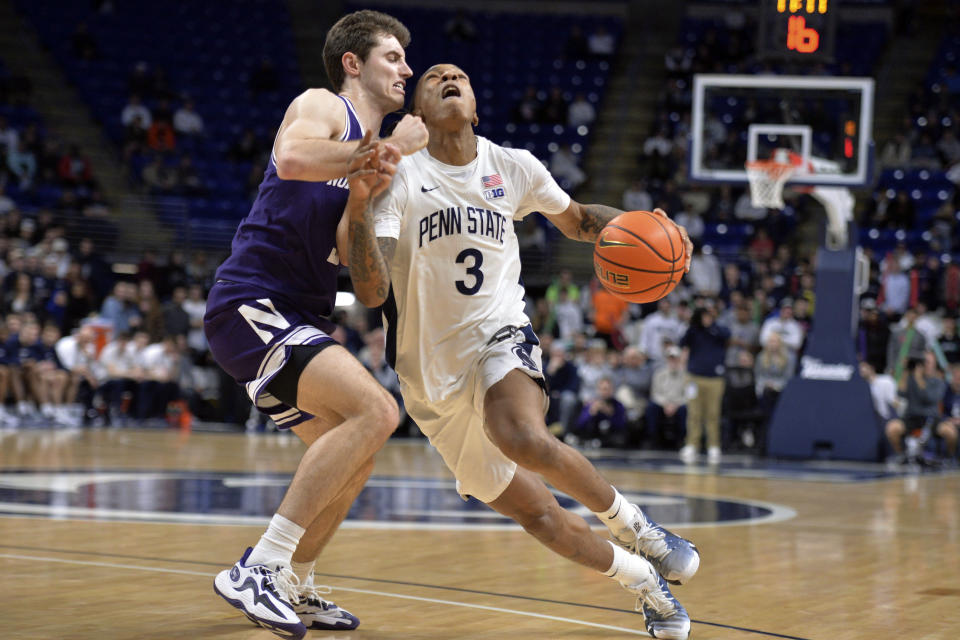 Penn State's Nick Kern Jr. (3) drives to the basket on Northwestern's Ryan Langborg (5) during the first half of an NCAA college basketball game Wednesday, Jan. 10, 2024, in State College, Pa. (AP Photo/Gary M. Baranec)