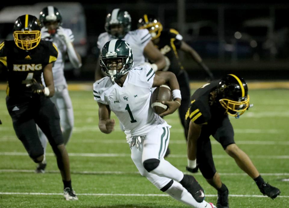 Detroit Cass Tech quarterback Corey Sadler runs the ball against King during second-half action at Martin Luther King Jr. High School in Detroit on Friday, Sept. 15, 2023.