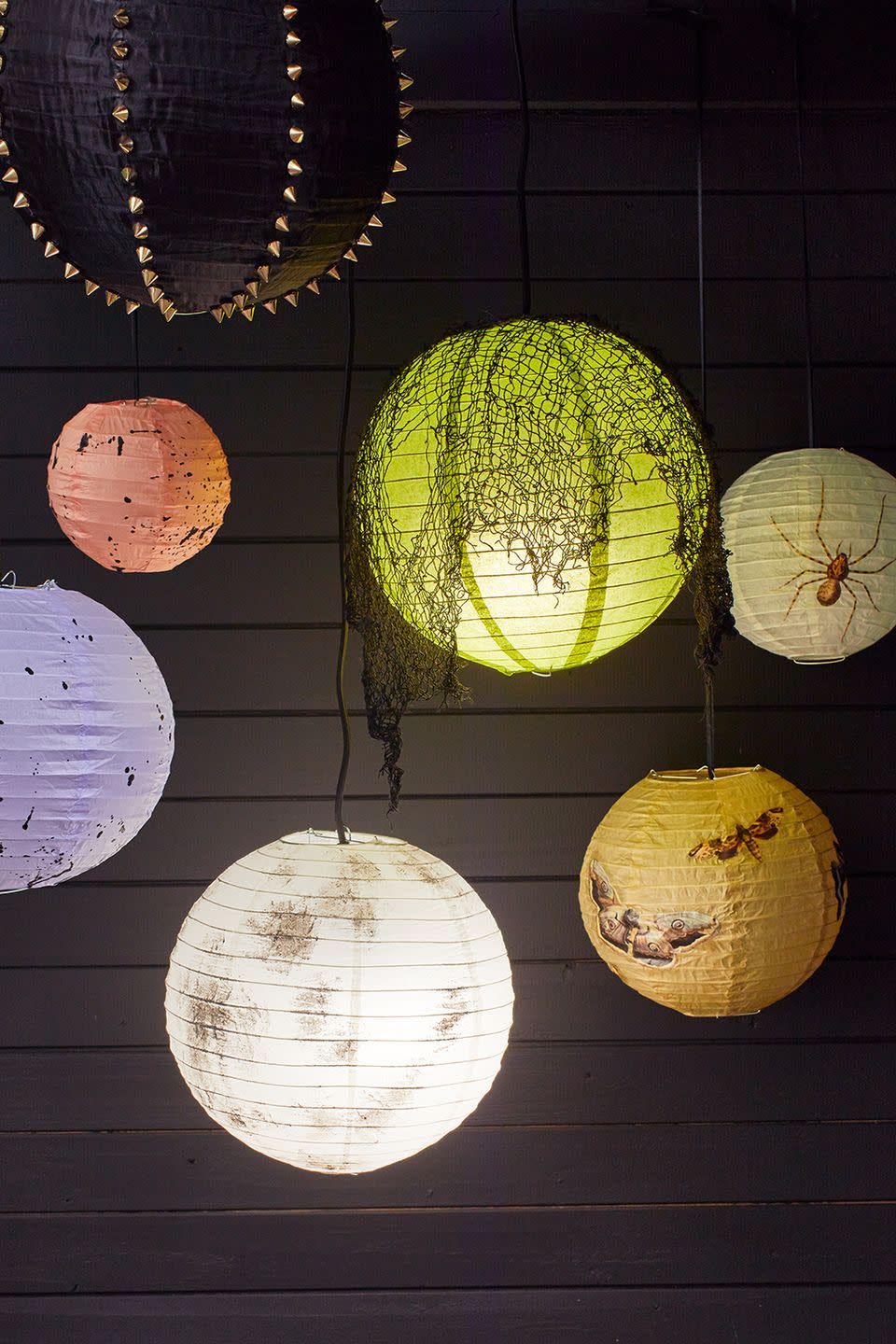 <p>Hang a display of crafty DIY paper lanterns on your covered front porch to light up the night.</p><p><em><a href="https://www.goodhousekeeping.com/home/craft-ideas/a34329004/diy-halloween-lantern-tutorial/" rel="nofollow noopener" target="_blank" data-ylk="slk:Get the tutorial »;elm:context_link;itc:0;sec:content-canvas" class="link ">Get the tutorial »</a></em></p>