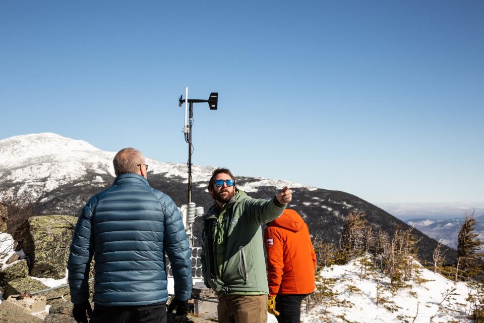 Jay Broccolo talks to visitors last winter at Mount Washington's auto road, which is often impassable for cars and trucks in winter.