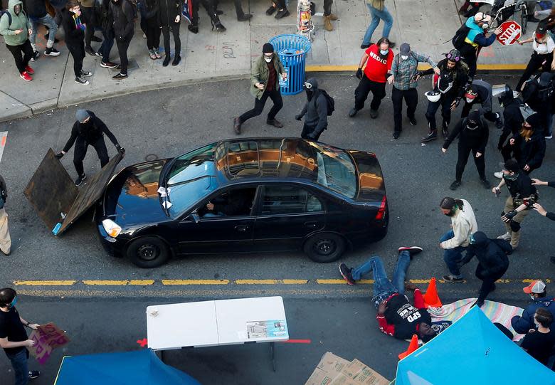 The car is seen in the middle of the crowd in Seattle. Source: Reuters