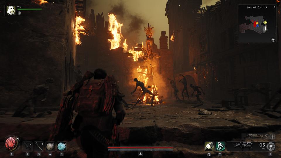 The player entering a ruined, burning city in Remnant 2.