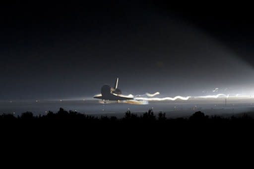 In this image released by NASA, the space shuttle Atlantis lands at Kennedy Space Center in Florida. The shuttle Atlantis cruised home for a final time Thursday, ending its last mission to the International Space Station and closing a 30-year chapter in American space exploration