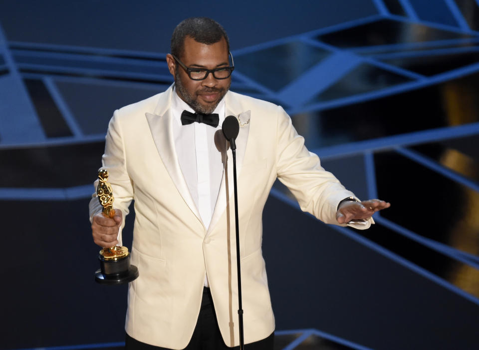 Jordan Peele accepts the award for best original screenplay for “Get Out” at the Oscars on Sunday, March 4, 2018, at the Dolby Theatre in Los Angeles. (Photo by Chris Pizzello/Invision/AP)