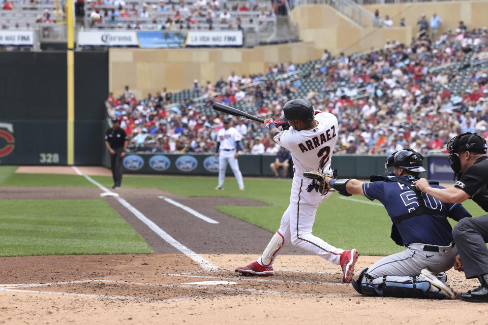 Minnesota Twins' Luis Arraez hits a grand slam during the third inning of a baseball game against the Tampa Bay Rays, Saturday, June 11, 2022, in Minneapolis. (AP Photo/Stacy Bengs)