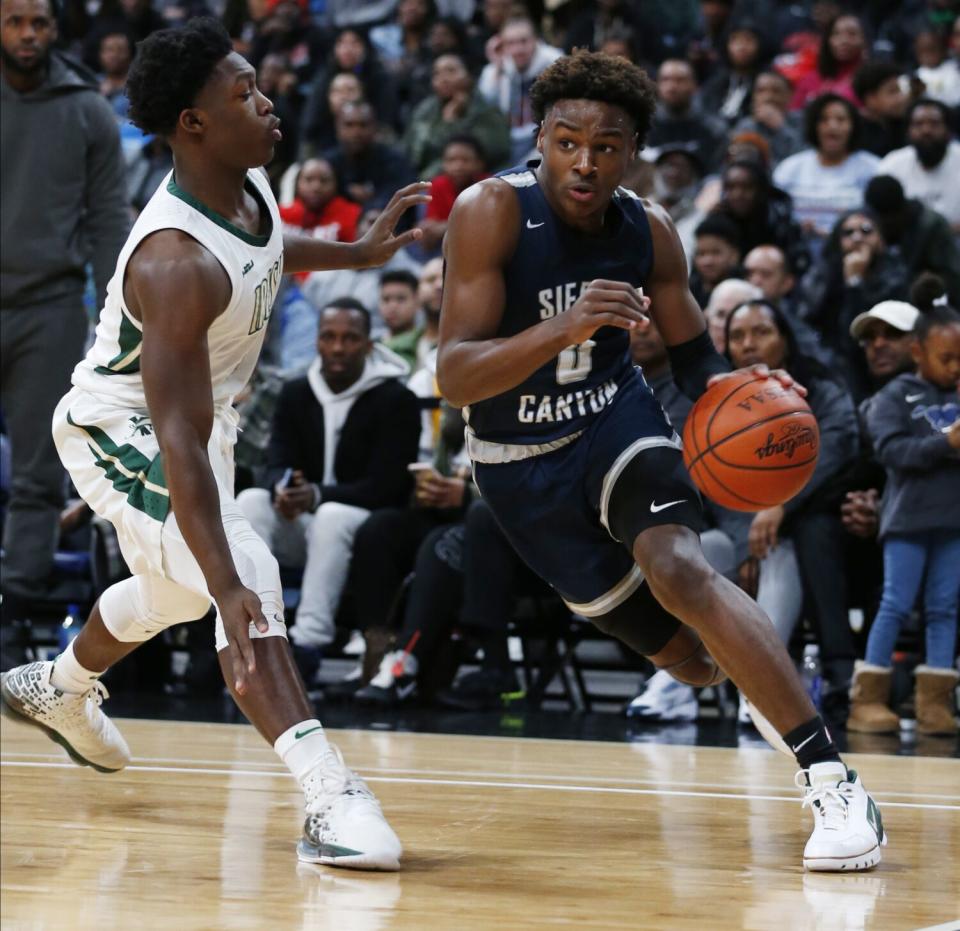 Sierra Canyon's Bronny James (0) drives against St. Vincent-St. Mary's Darrian Lewis