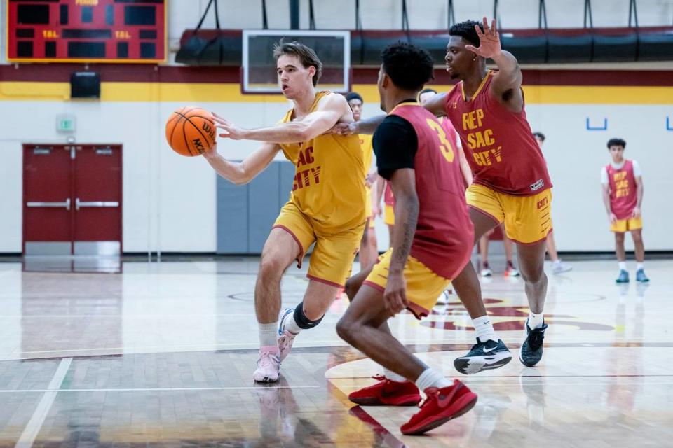 Sacramento City Panthers guard Andrew “AJ” Ferrara-Jones passes to the wing during the men’s basketball practice Wednesday at Sacramento City College. His father, coach Andrew Jones, has survived a brain tumor to inspire his team to a 17-2 record.