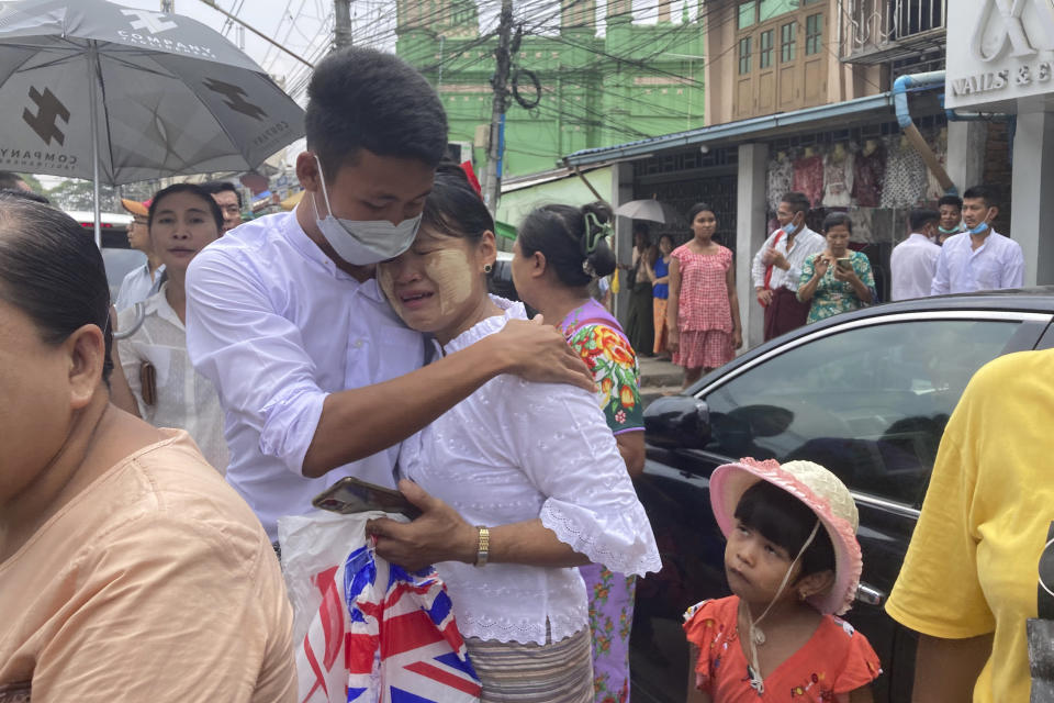 A man is welcomed by his mother after his release from Insein Prison in Yangon, Myanmar Wednesday, May 3, 2023. Myanmar’s ruling military council says it is releasing more than 2,100 political prisoners as a humanitarian gesture. Thousands more remain imprisoned on charges generally involving nonviolent protests or criticism of military rule, which began when the army seized power in 2021. (AP Photo/Thein Zaw)