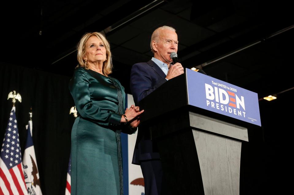 Former Vice President Joe Biden speaks to supporters alongside his wife, Jill, on caucus night 2020 at the Olmsted Center at Drake University in Des Moines. Delayed results allow him to deflect attention from what would become a fourth-place finish.