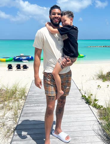 <p>Jayson Tatum/Instagram</p> Jayson Tatum holding his son Deuce while on vacation