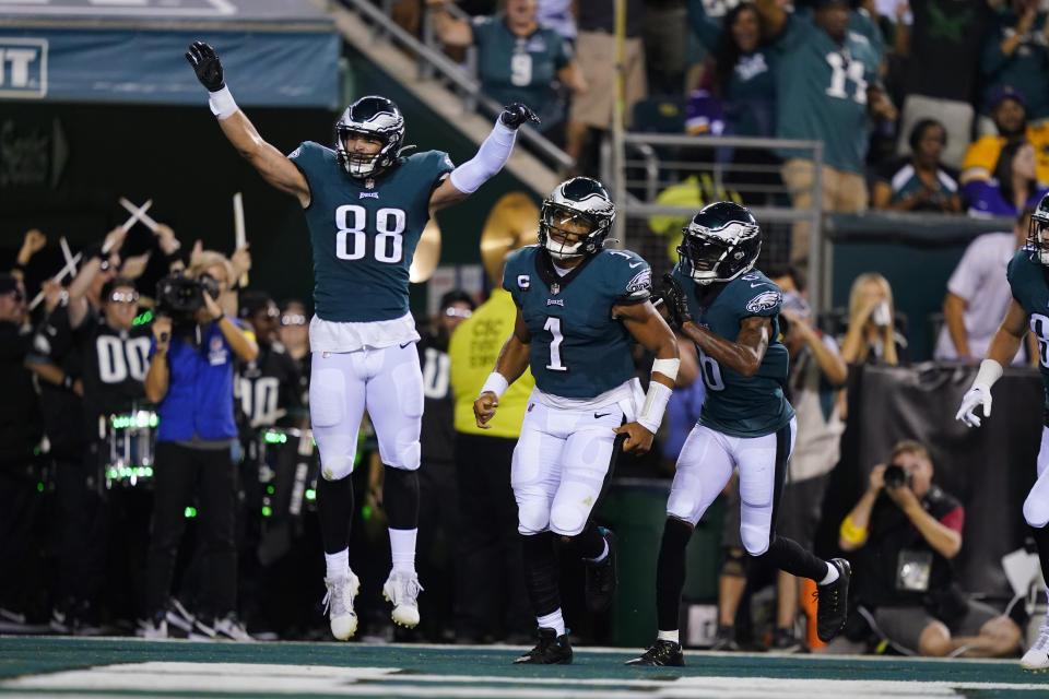 Philadelphia Eagles quarterback Jalen Hurts (1) celebrates with teammates after scoring on a 26-yard touchdown run during the first half of an NFL football game against the Minnesota Vikings, Monday, Sept. 19, 2022, in Philadelphia. (AP Photo/Matt Slocum)