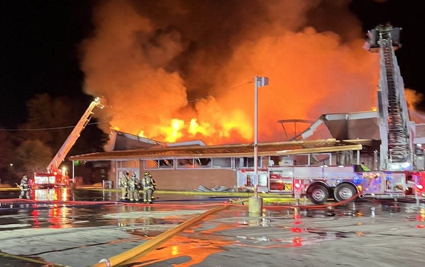 The fire broke out at about 8:40 p.m. Sunday at the Walgreens-anchored shopping center in Clinton Town.