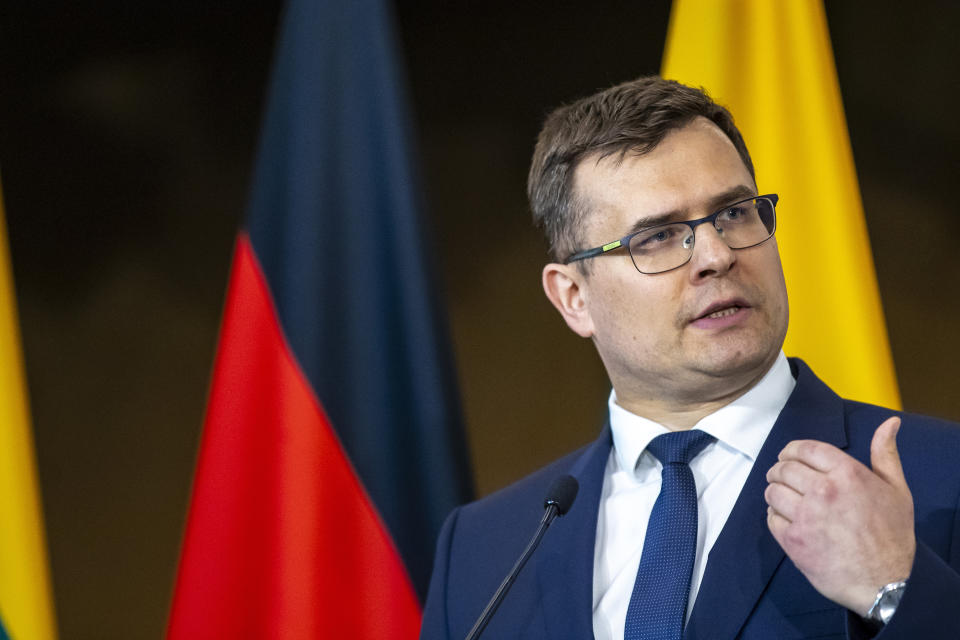 Lithuanian Defense Minister Laurynas Kasciunas speaks during a media joint conference with German Army Chief Lt. Gen. Alfons Mais and Lithuanian Chief of Defence Gen. Valdemaras Rupsys as members of the Headquarters initial command element of the Bundeswehr's 45th Brigade Lithuania arrival by plane at a airport in Vilnius, Lithuania, Monday, April 8, 2024. Germany has made a commitment to deploy a heavy brigade with three maneuver battalions and all necessary enablers, including combat support and provision units, to Lithuania. In total, approx. 5 thousand German military and civilian personnel are expected to move to Lithuania with families in stationing the Brigade. (AP Photo/Mindaugas Kulbis)