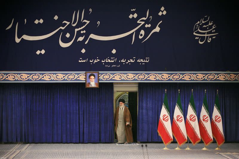 Iran's Supreme Leader Ayatollah Ali Khamenei arrives to cast his vote at a polling station during parliamentary elections in Tehran