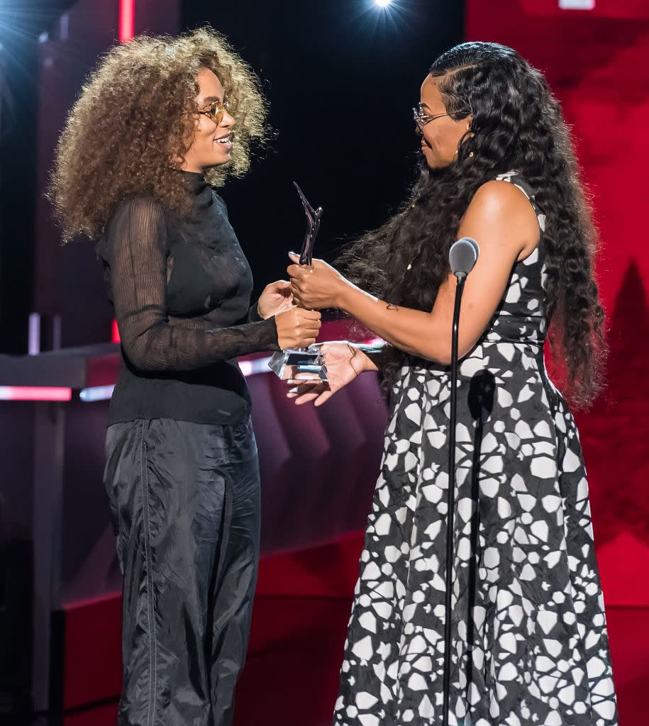 NEWARK, NJ - AUGUST 05: Singer-songwriter Solange Knowles accepts her award onstage from CEO, Founder BLACK GIRLS ROCK! Beverly Bond during Black Girls Rock! 2017 at New Jersey Performing Arts Center on August 5, 2017 in Newark, New Jersey. (Photo by Gilbert Carrasquillo/FilmMagic)
