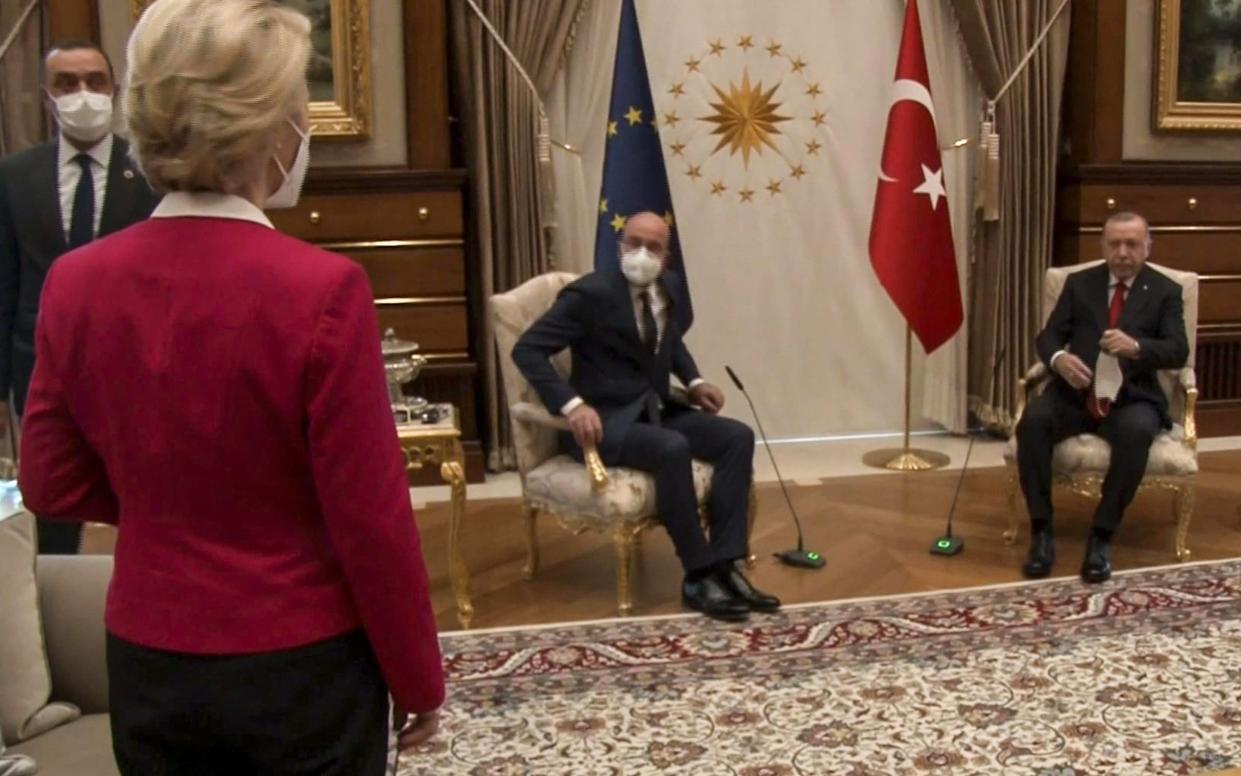 Ursula von der Leyen looks on as President Recep Tayyip Erdogan (R) and EU Council President Charles Michel take the only chairs in the room - AFP