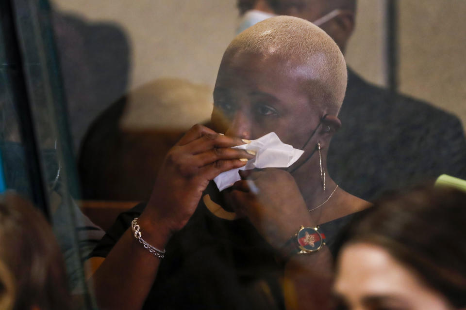 Cleopatra Cowley, mother of Hadiya Pendleton, wipes her face as she listens to prosecuting attorney Brian Holmes speak during the sentencing hearing of Kenneth Williams for the murder of her daughter, Hadiya Pendleton, at the Leighton Criminal Court Building in Chicago, Tuesday, July 20, 2021. Cook County Judge Diana Kenworthy on Tuesday ordered 29-year-old Williams to serve 35 years for first-degree murder and an additional seven years for aggravated battery. (Jose M. Osorio/ Chicago Tribune via AP, Pool)