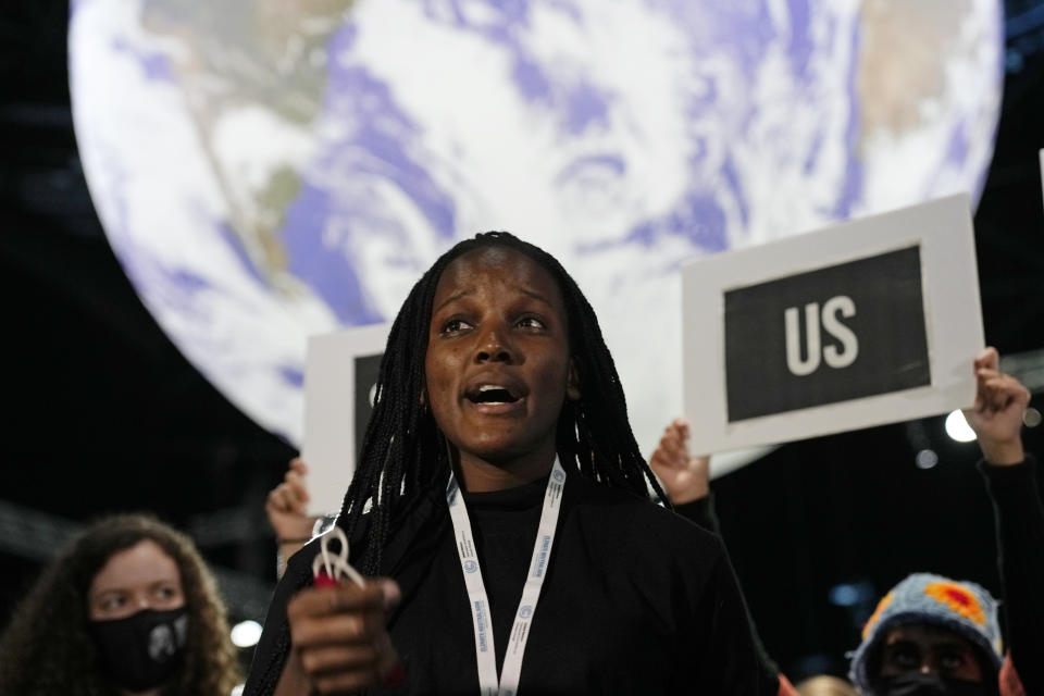 Climate activist Vanessa Nakate engages in a 'Show US The Money' protest at the COP26 U.N. Climate Summit in Glasgow, Scotland, Monday, Nov. 8, 2021. The U.N. climate summit in Glasgow gathers leaders from around the world, in Scotland's biggest city, to lay out their vision for addressing the common challenge of global warming. (AP Photo/Alastair Grant)