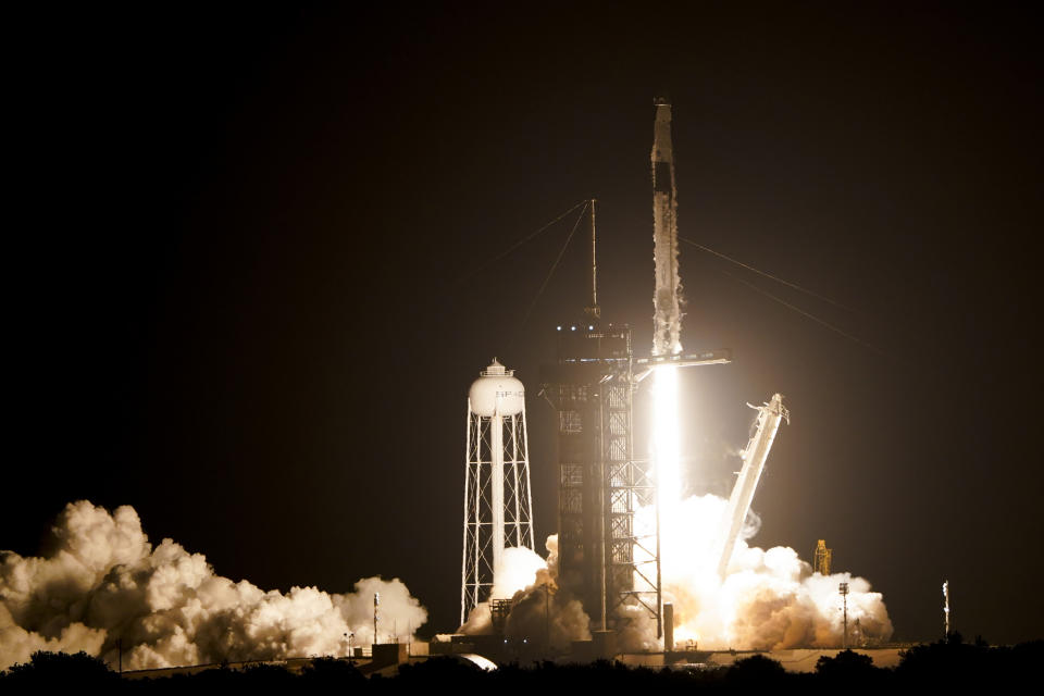 A SpaceX Falcon 9 rocket lifts off from pad 39A at the Kennedy Space Center in Cape Canaveral, Fla., Wednesday, April 27, 2022. NASA astronauts Kjell Lindgren, Robert Hines, and Jessica Watkins, and European Space Agency astronaut Samantha Cristoforetti on the Crew Dragon spacecraft begin a six-month expedition on the International Space Station. (AP Photo/John Raoux)