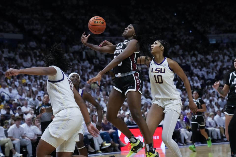 South Carolina guard Raven Johnson is fouled by LSU forward Angel Reese (10) in the second half of an NCAA college basketball game in Baton Rouge, La., Thursday, Jan. 25, 2024. South Carolina won 76-70. (AP Photo/Gerald Herbert)