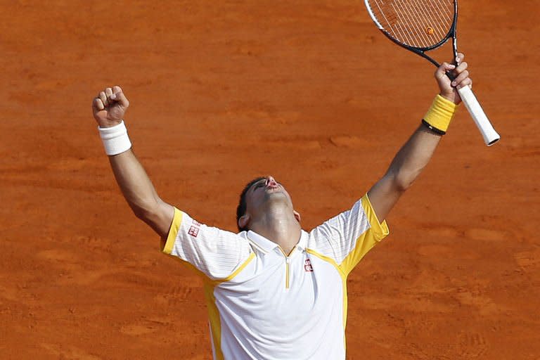 Serbian Novak Djokovic celebrates after winning the match against Russian Mikhail Youzhny, on April 17, 2013 during the Monte-Carlo ATP Masters Series Tournament tennis match in Monaco