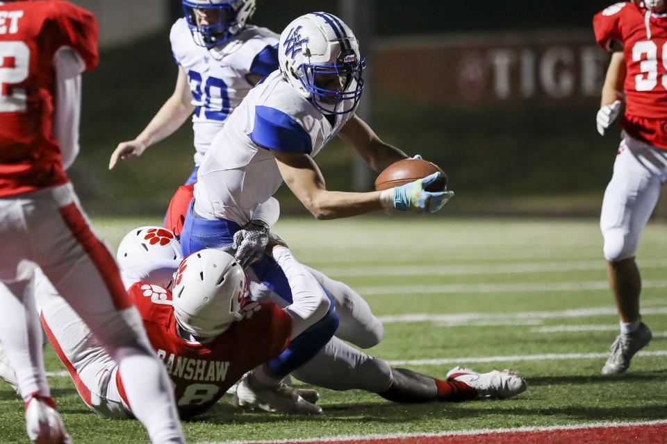 Walton-Verona running back Tyson Beach (7) reaches the ball in for a touchdown against Beechwood in the second half at Beechwood High School. Nov. 19, 2021