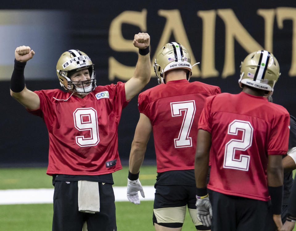 New Orleans Saints quarterback Drew Brees (9) reacts to beating the other quarterbacks to the tape during NFL football training camp Saturday, Aug. 29, 2020, in New Orleans. (David Grunfeld/The Advocate via AP, Pool)