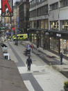 A body, centre at rught, lies on the ground on at the scene after a truck crashed into a department store injuring several people in central Stockholm, Sweden, Friday April 7, 2017. (Andreas Schyman, TT News Agency via AP)