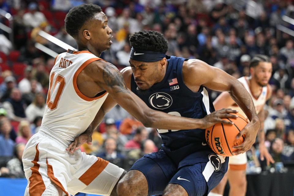 Texas guard Jabari Rice tries to steal the ball from Penn State guard Jalen Pickett during the first half of Saturday night's 71-61 win at Wells Fargo Arena in Des Moines, Iowa. The win sends the No. 2-seeded Longhorns to the Sweet 16.