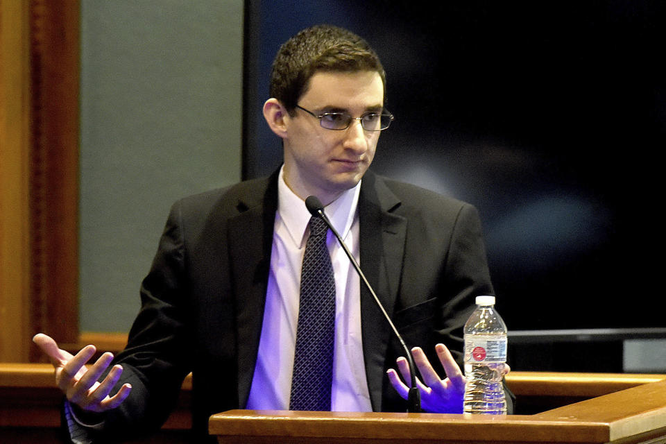 Defendant Joseph Elledge testifies how he carried his wife Mengqi Ji's body to her car after he found her dead in the couple's apartment in Oct. 2019, during his murder trial Wednesday, Nov. 10, 2021, in Columbia, Mo. Elledge is accused of killing his 28-year-old wife, whom he reported missing in October 2019. Her remains were found in March in a park near Columbia, Mo. (Don Shrubshell/Columbia Daily Tribune via AP, Pool)