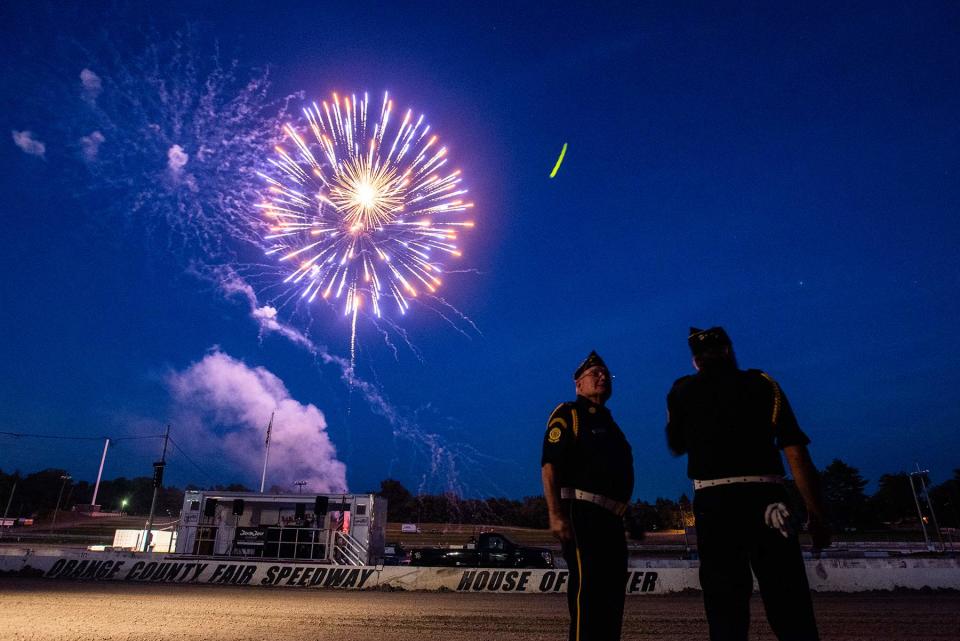 In this 2020 file photo, veterans from the American Legion watch the fireworks as they wait for their bus at the Orange County Fair Speedway.