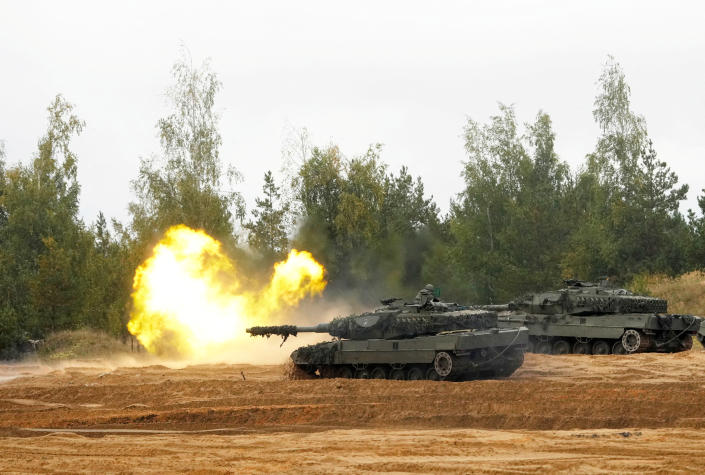 A Leopard 2 tank fires during a military drill.
