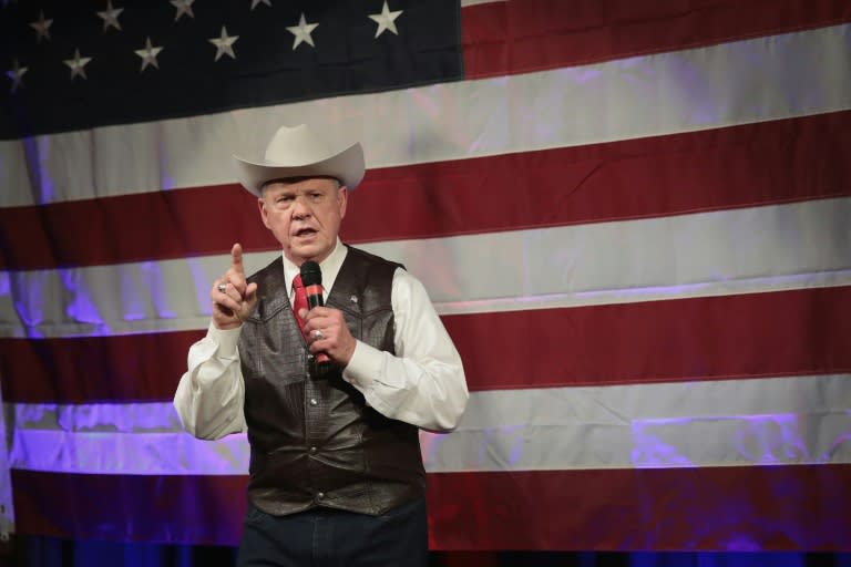 Allegations about the conduct of Roy Moore, speaking at a campaign rally in Fairhope, Alabama, have divided Republicans, but he still has President Donald Trump's backing in the race for a Senate seat